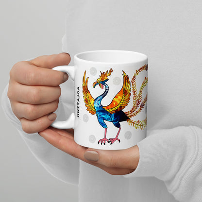 KoreaJoa white ceramic mug featuring the Vermilion Bird, a mythical Korean creature with vibrant blue, orange, and yellow fiery wings and tail.